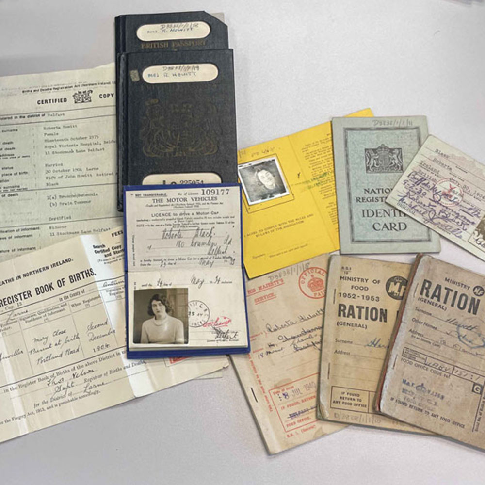 Archive material from the collection, including wartime ration books and identity documents