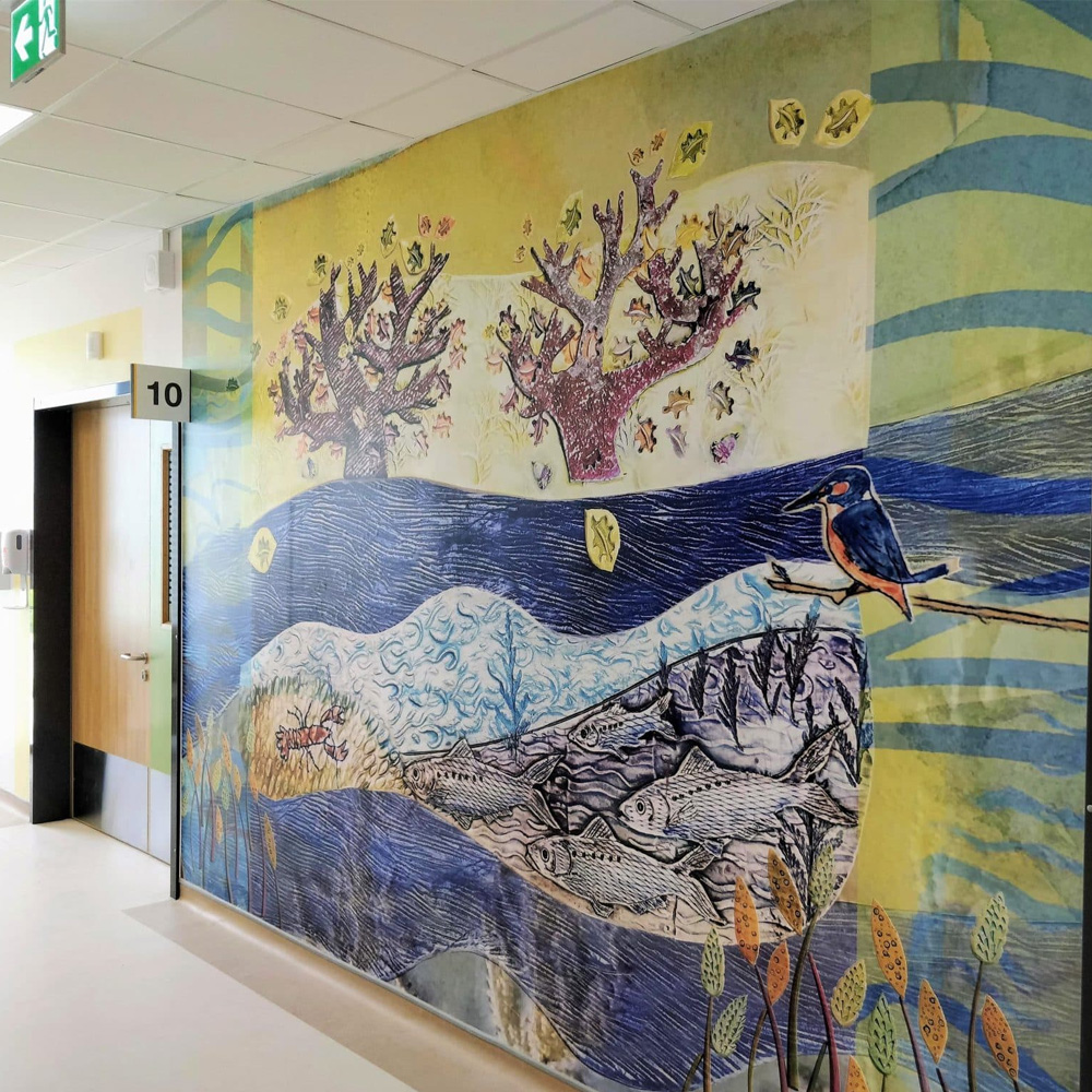 A large ceramic mural by Diane McCormick installed on a wall