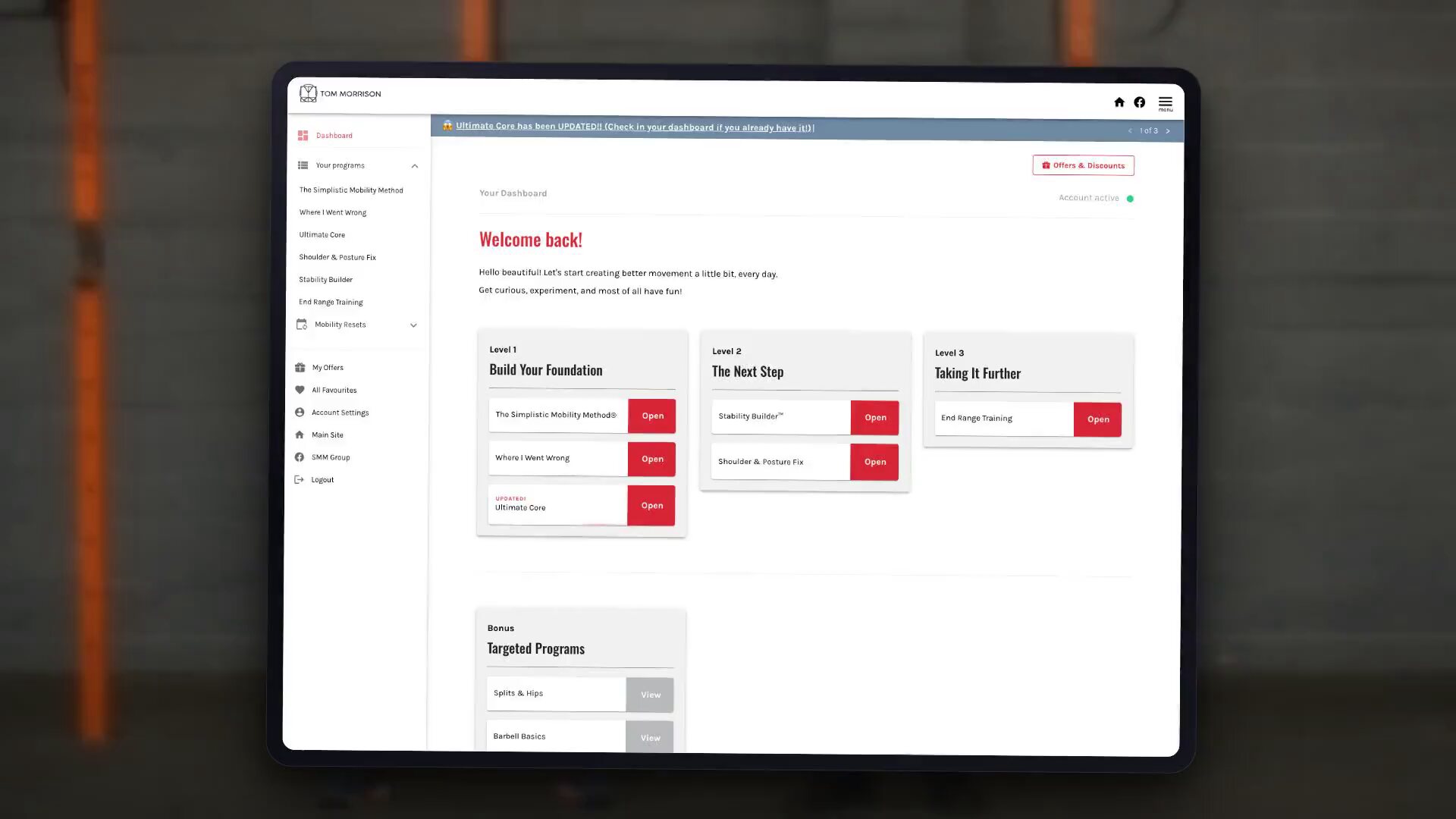 The Tom Morrison customer dashboard on an iPad and on phones, showing programmes, video lessons, the progress tracker and the workout generator